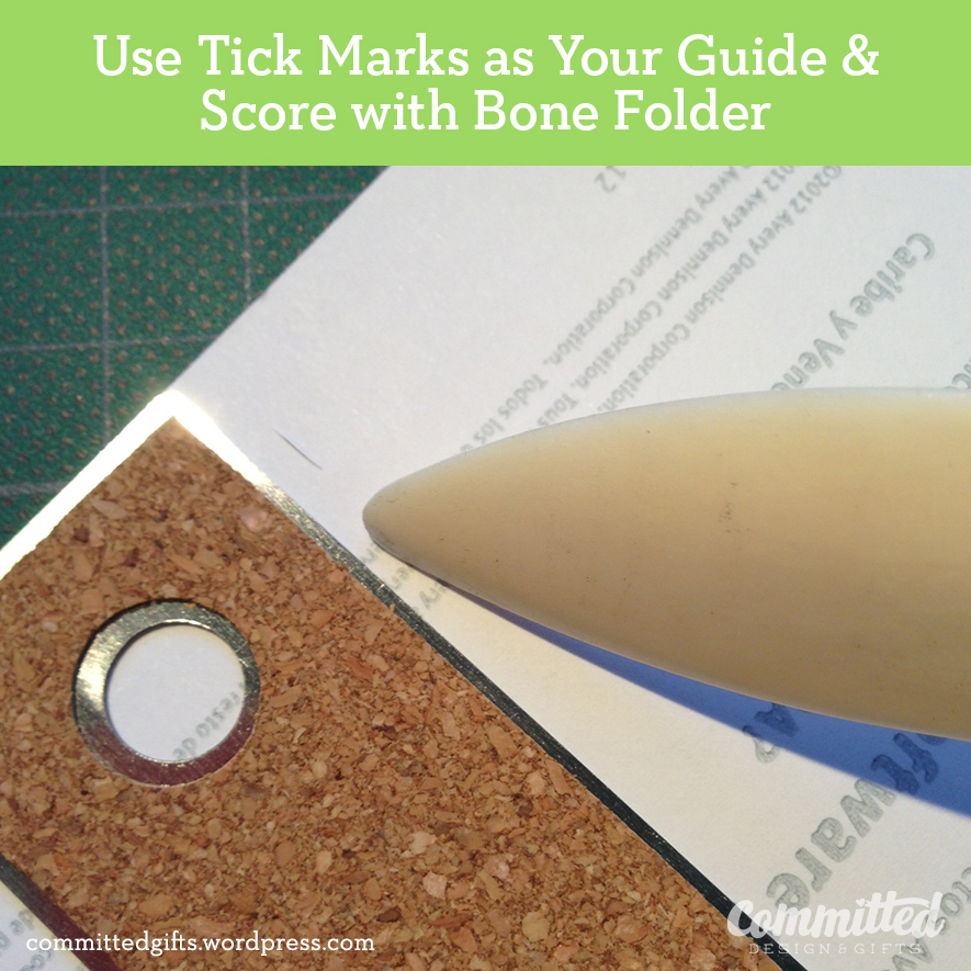 Score the back by pressing down with the bone folder. Use the ruler as a guide.